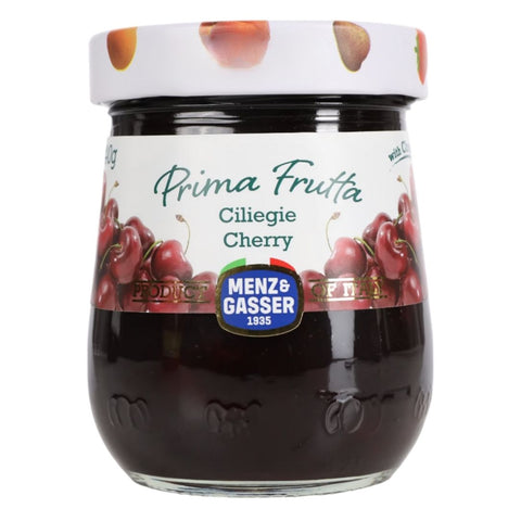 Jar of Prima Frutta cherry jam with Menz & Gasser branding on a white background